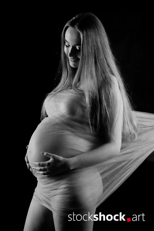 Young pregnant woman - stock image