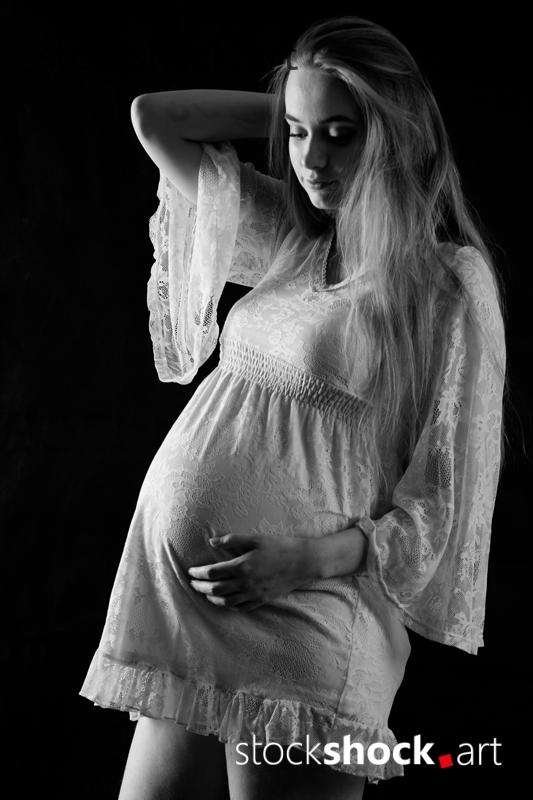 Young pregnant woman - stock image