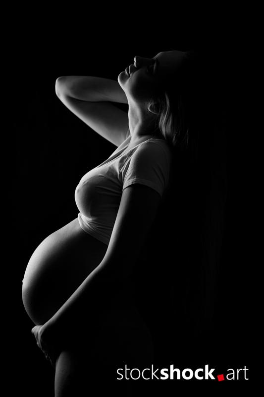 Young pregnant woman - stock image