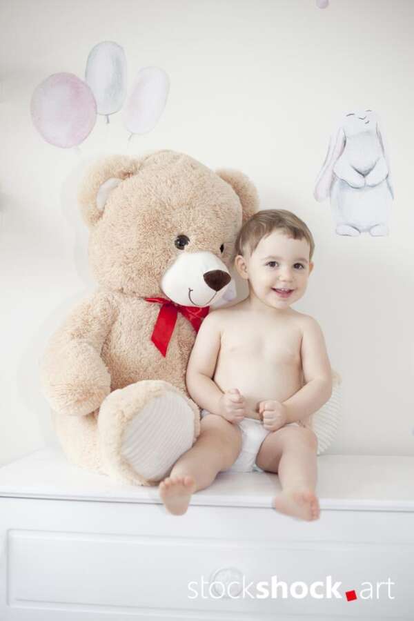 Happy girl with teddy bear against pastel background – stock