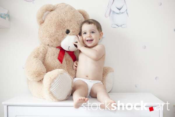 Happy girl with teddy bear against pastel background – stock
