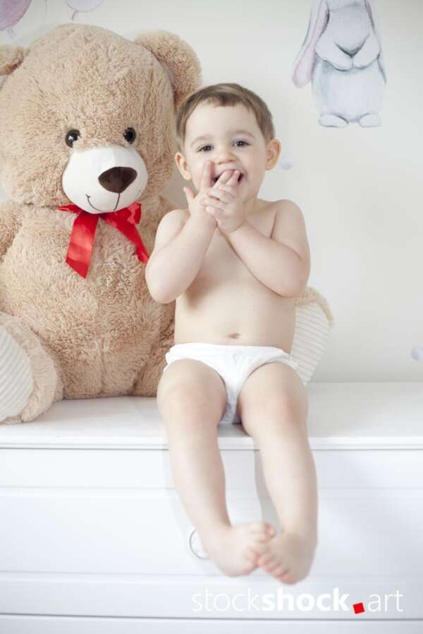 Happy girl with teddy bear against pastel background – stock