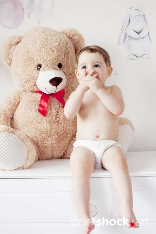Happy girl with teddy bear against pastel background – stock