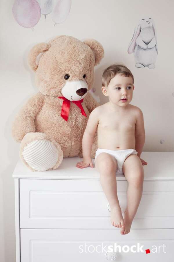 Happy girl with teddy bear against pastel background – stock