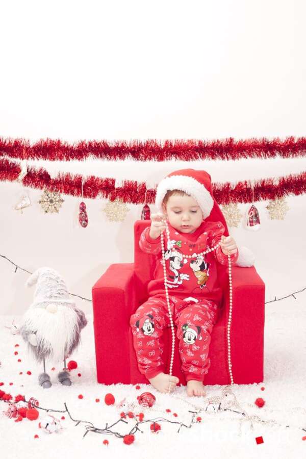 A child in a Santa Claus costume in an armchair. Christmas holidays - stockshock image