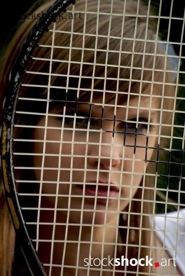 model with a tennis racket