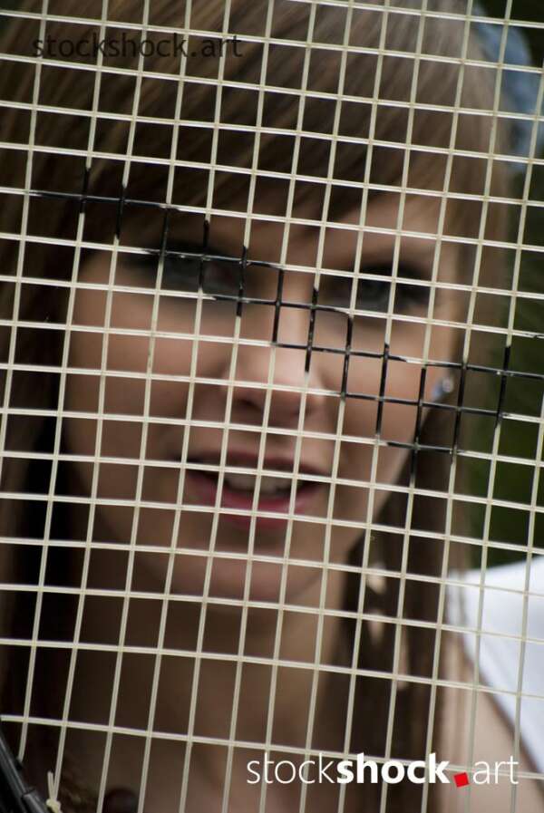 model with a tennis racket