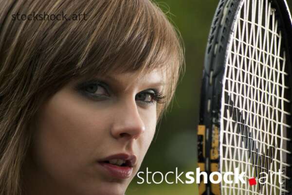 model with a tennis racket
