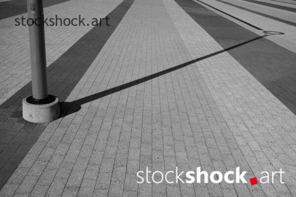 Shadow on the street, black and white - stock image