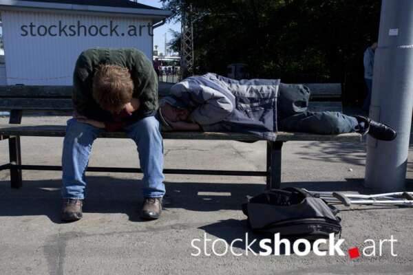 man sleeping on a bench, homeless