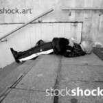 man sleeping on the stairs, homeless