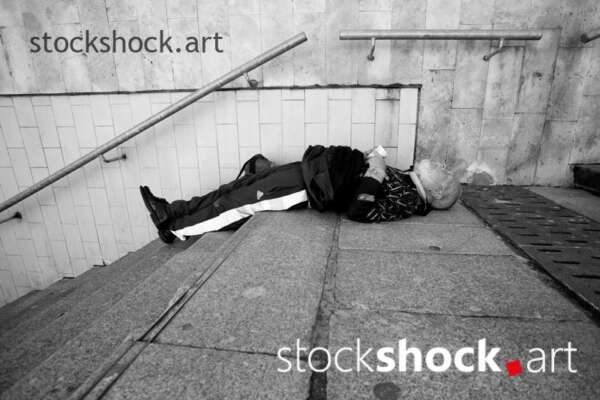 man sleeping on the stairs, homeless