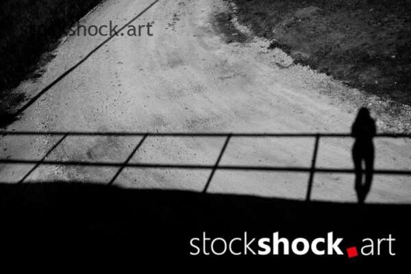 shadow of woman on bridge, black and white, stock image