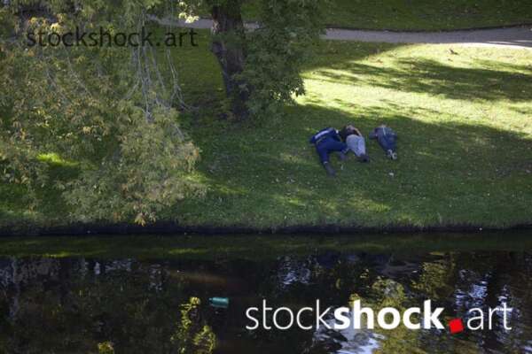 people sleeping on the grass