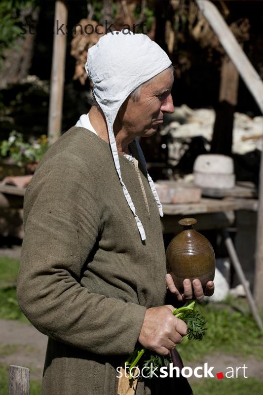 Cēsis, Latvia, man at the table in an original costume - stock image