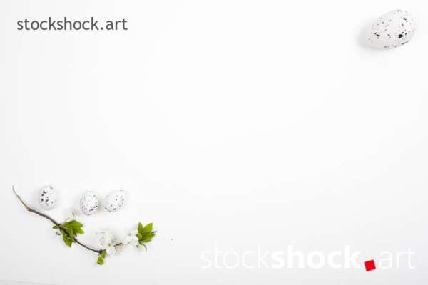 Easter lamb with eggs and a branch of blooming cherry on a white background - stock image