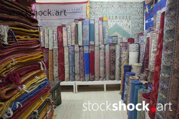 Moroccan rugs in the store, stock image
