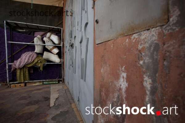 Mannequin busts stored in the back of the store