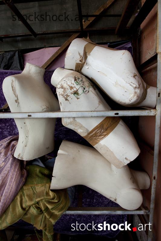 Mannequin busts stored in the back of the store