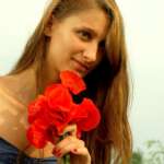 Beautiful girl in a poppy glade