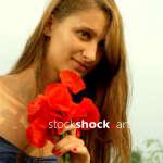 Beautiful girl in a poppy glade