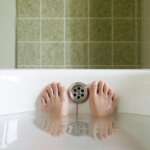 photo of feet in the bathtub