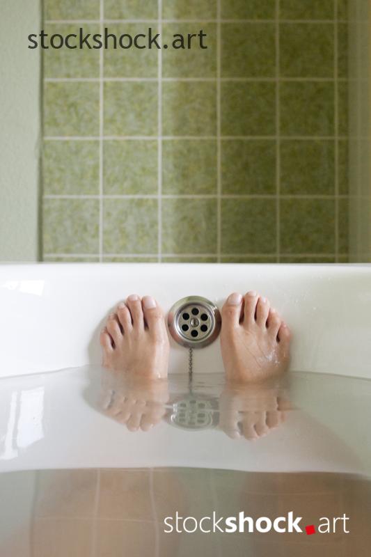 photo of feet in the bathtub