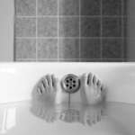 photo of feet in the bathtub