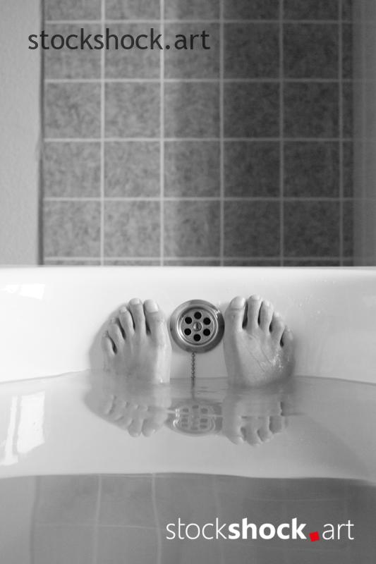 photo of feet in the bathtub