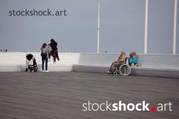 People relax on the pier, stock image