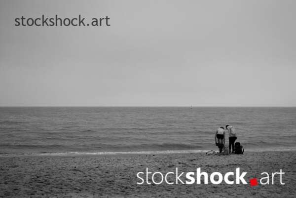 Gdańsk, Poland, Baltic Sea, two people undress on the shore in winter to dive into the sea