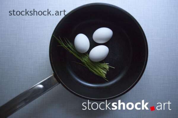 still life, egs in a pan with chives stock image
