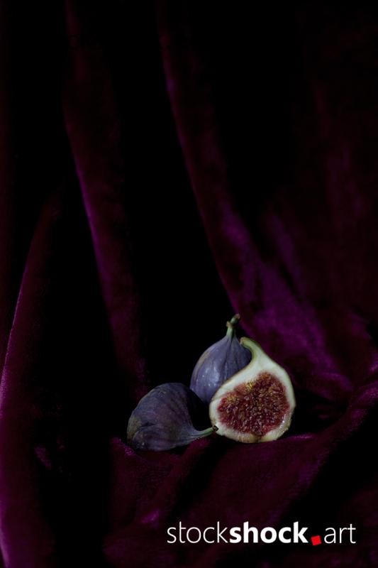 still life, fig on a burgundy background, stock image
