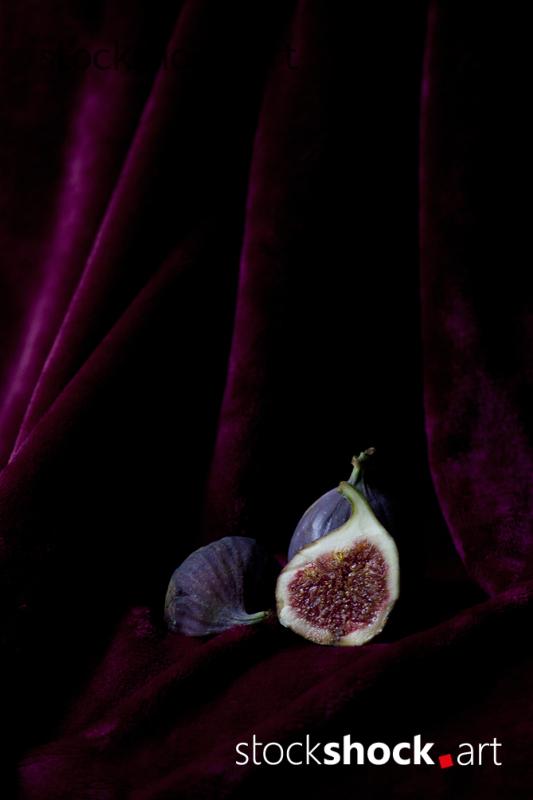 still life, fig on a burgundy background, stock image