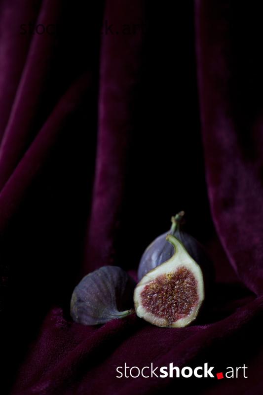still life, fig on a burgundy background, stock image