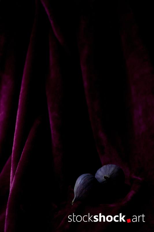 still life, fig on a burgundy background, stock image