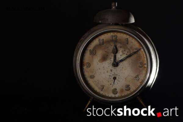 Clock, old alarm clock on black background